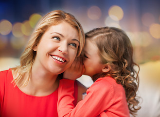 Image showing happy mother and girl whispering into ear