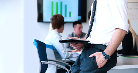 Image showing Businessman using tablet in modern office