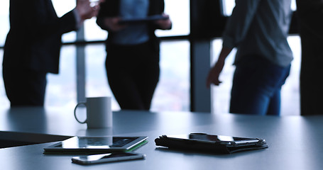 Image showing tablet, mobile cell phone and cup of coffee  in office with busi