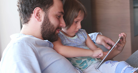 Image showing Father Daughter using Tablet in modern apartment