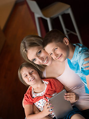 Image showing Young Family Using A Tablet To Make Future Plans