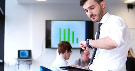 Image showing Businessman using tablet in modern office