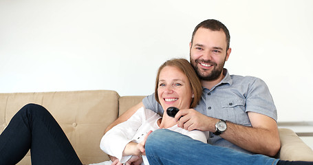 Image showing senoior couple watching tv in modern villa