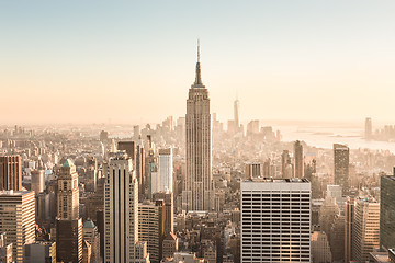 Image showing New York City skyline with urban skyscrapers at sunset, USA.