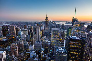 Image showing New York City skyline with urban skyscrapers at dusk, USA.