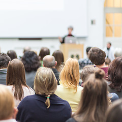 Image showing Woman giving presentation in lecture hall at university.