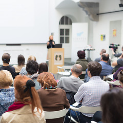 Image showing Woman giving presentation in lecture hall at university.