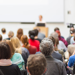 Image showing Woman giving presentation in lecture hall at university.