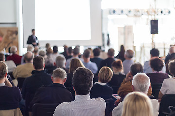 Image showing Business speaker giving a talk at business conference event.