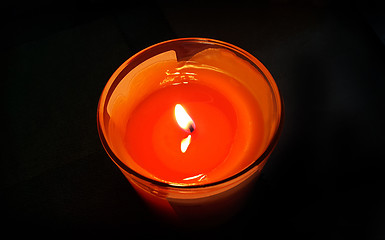 Image showing Burning candle in the dark