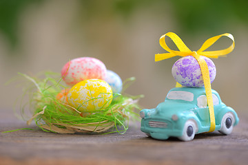 Image showing Toy car carrying easter eggs