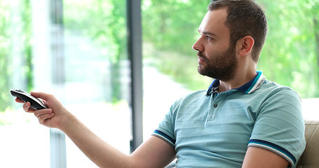 Image showing Happy Man Watching Television