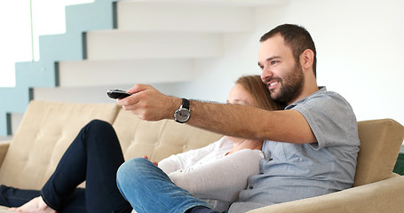 Image showing senoior couple watching tv in modern villa