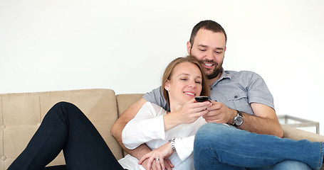 Image showing senoior couple watching tv in modern villa