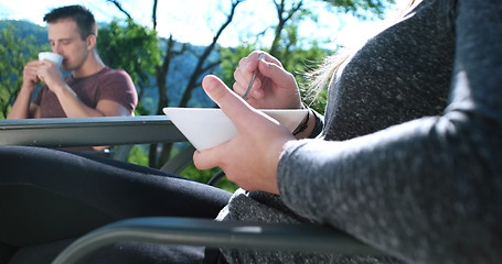 Image showing Happy Couple Drinking Coffee and eating breakfast on terrace of 