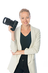 Image showing Woman photographer takes images with dslr camera