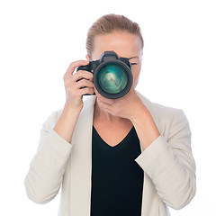 Image showing Woman photographer takes images with dslr camera