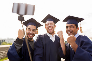 Image showing happy male students or graduates taking selfie