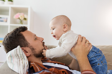 Image showing happy father with little baby boy at home