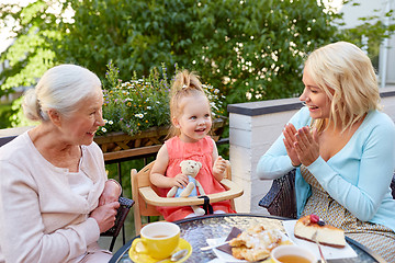 Image showing mother, daughter and grandmother at cafe