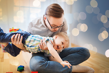 Image showing father with son playing and having fun at home