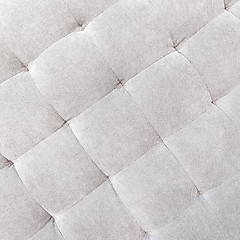 Image showing Gray buttoned fabric background