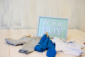 Image showing Sign with text and baby clothes