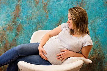 Image showing Young pregnant woman sitting