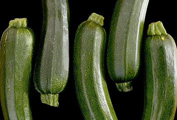 Image showing Zucchini (zucchetti, courgettes) on a black background