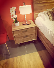 Image showing Contemporary bedroom in warm orange tones