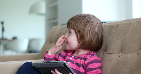 Image showing Child using tablet in modern apartment