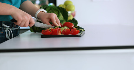 Image showing Young Couple In Modern Kitchen  Preparing Food