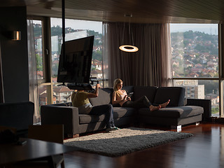 Image showing Woman Using Tablet On Couch At Home