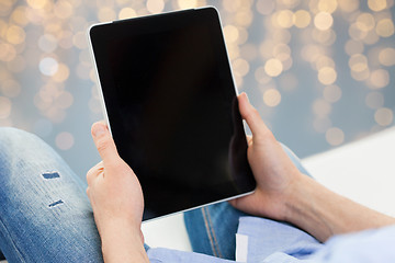 Image showing close up of male hands holding tablet pc