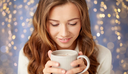 Image showing close up of happy woman with coffee cup at home