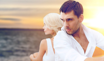 Image showing unhappy couple over sea background