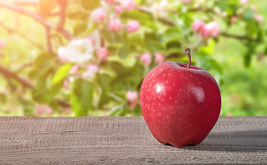 Image showing Red apple on a wooden table