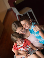 Image showing Young Family Using A Tablet To Make Future Plans