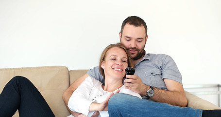 Image showing senoior couple watching tv in modern villa