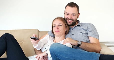 Image showing senoior couple watching tv in modern villa