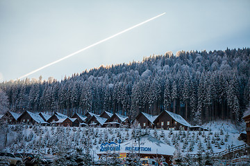 Image showing Bukovel, Ukraine - December 22, 2016: The wooden houses in the Ukrainian resort Bukovel. winter landscape UKRAINE March 06 2017