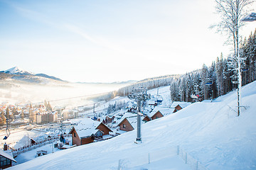 Image showing View of beautiful snowy mountains, forests