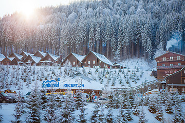 Image showing Bukovel, Ukraine - December 22, 2016: The wooden houses in the Ukrainian resort Bukovel. winter landscape UKRAINE March 06 2017