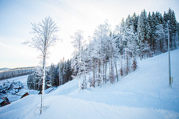 Image showing View of beautiful snowy mountains, forests