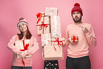 Image showing Father and mother give gifts to little daughter at studio