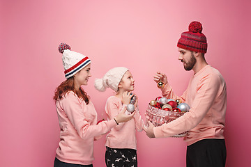 Image showing Father and mother give gifts to little daughter at studio