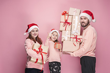 Image showing Father and mother give gifts to little daughter at studio