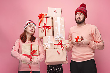 Image showing Father and mother give gifts to little daughter at studio