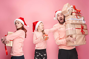 Image showing Father and mother give gifts to little daughter at studio