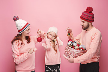 Image showing Father and mother give gifts to little daughter at studio